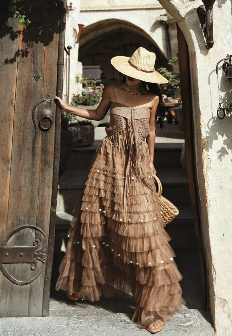 Bohemian summer outfit styling with a warm brown woven maxi dress and textured statement details