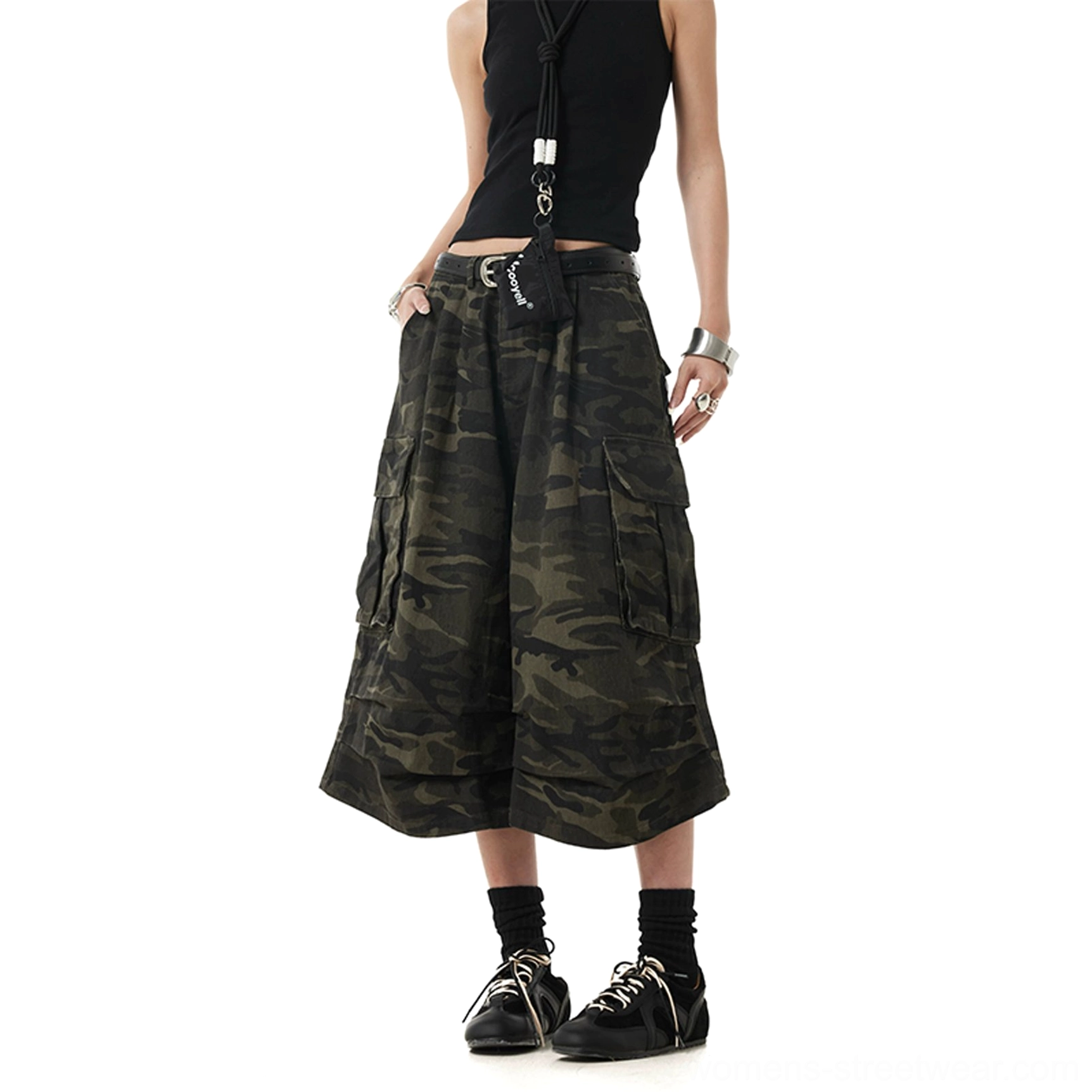 Side view of cropped culotte style camouflage cargo pants with wide legs waist bag charm and black tank top