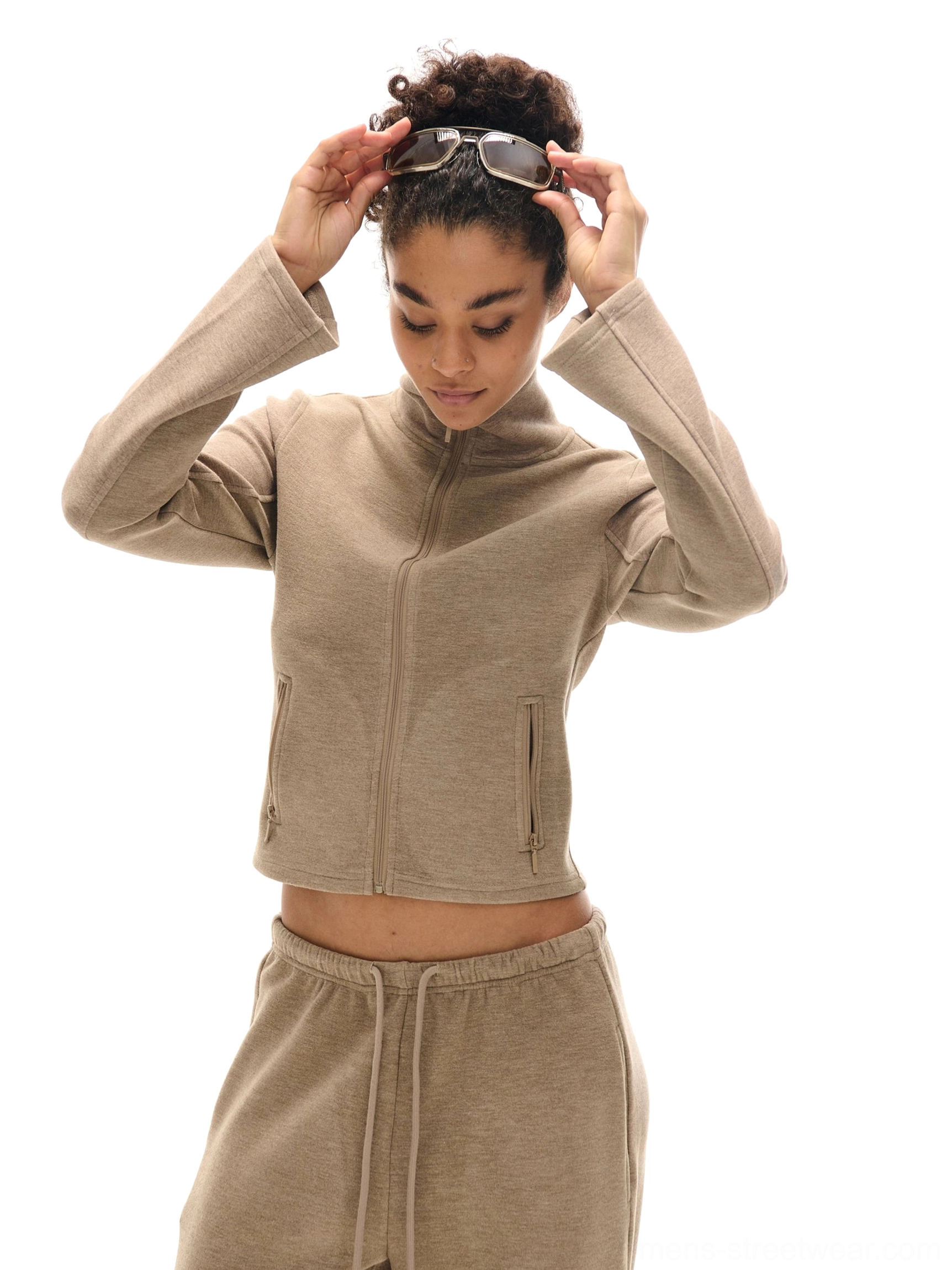 Khaki cropped high collar zip-up sweatshirt and wide-leg sweatpants set styled as Korean streetwear with female model adjusting sunglasses