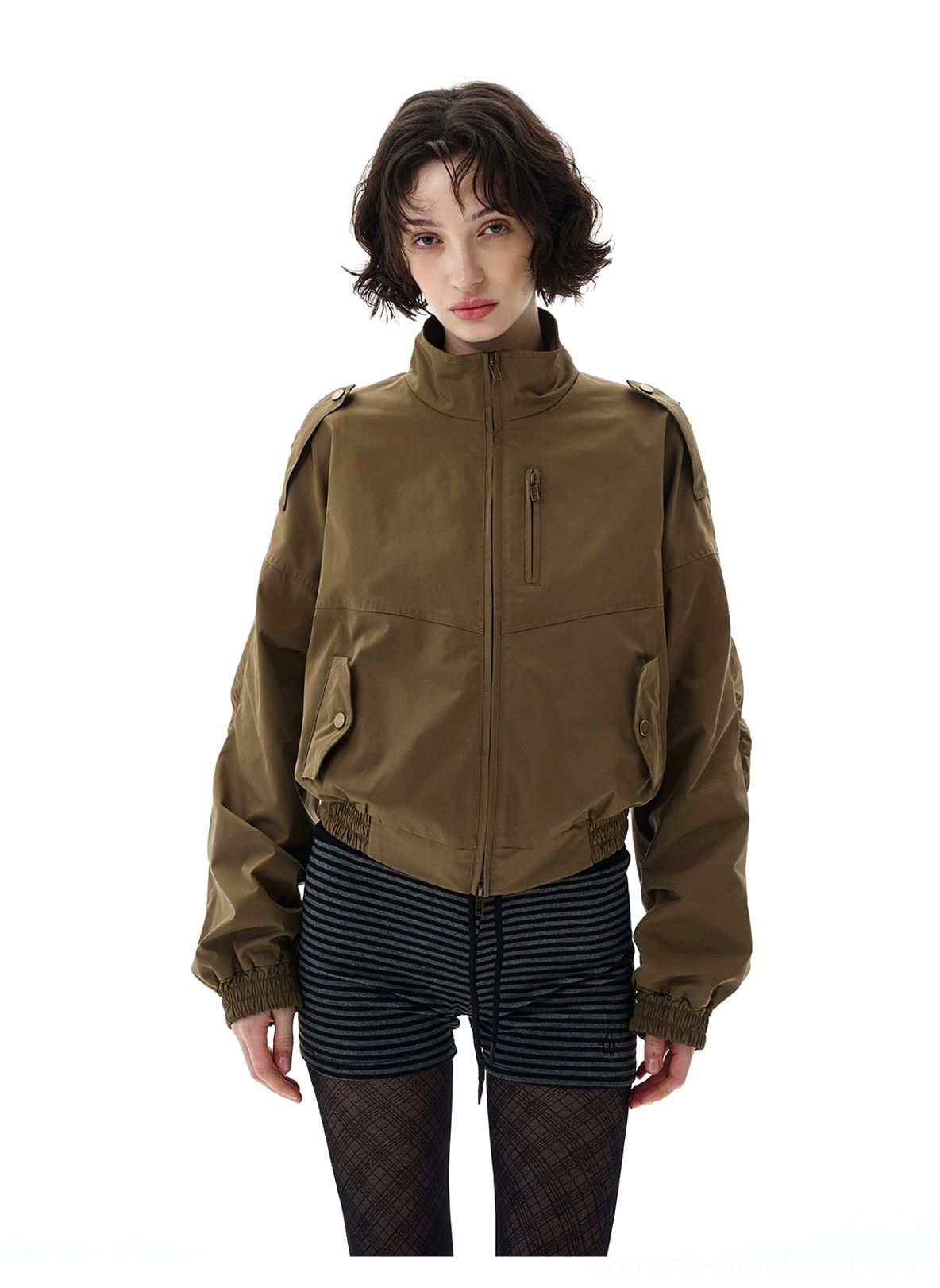 Cropped olive utility bomber jacket detail with high collar, side zip pocket, snap chest pockets, and loose streetwear sleeves