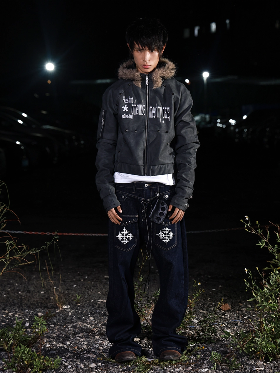 Full body night streetwear outfit featuring a cropped gray PU jacket with faux fur hood, front zipper, and graphic lettering