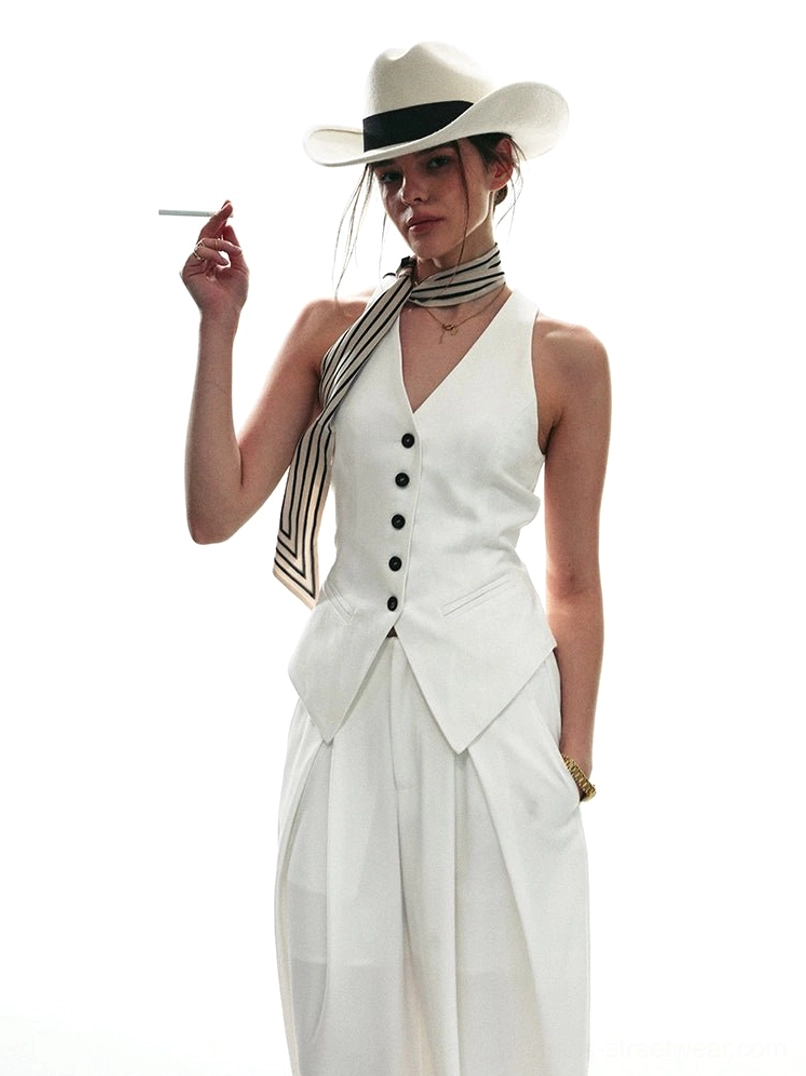 Cropped white tailored halter vest with relaxed high-waisted wide-leg trousers in a retro elegant streetwear outfit