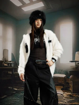 White crucifix faux fur zip hoodie styled on a female model in a relaxed gothic streetwear outfit