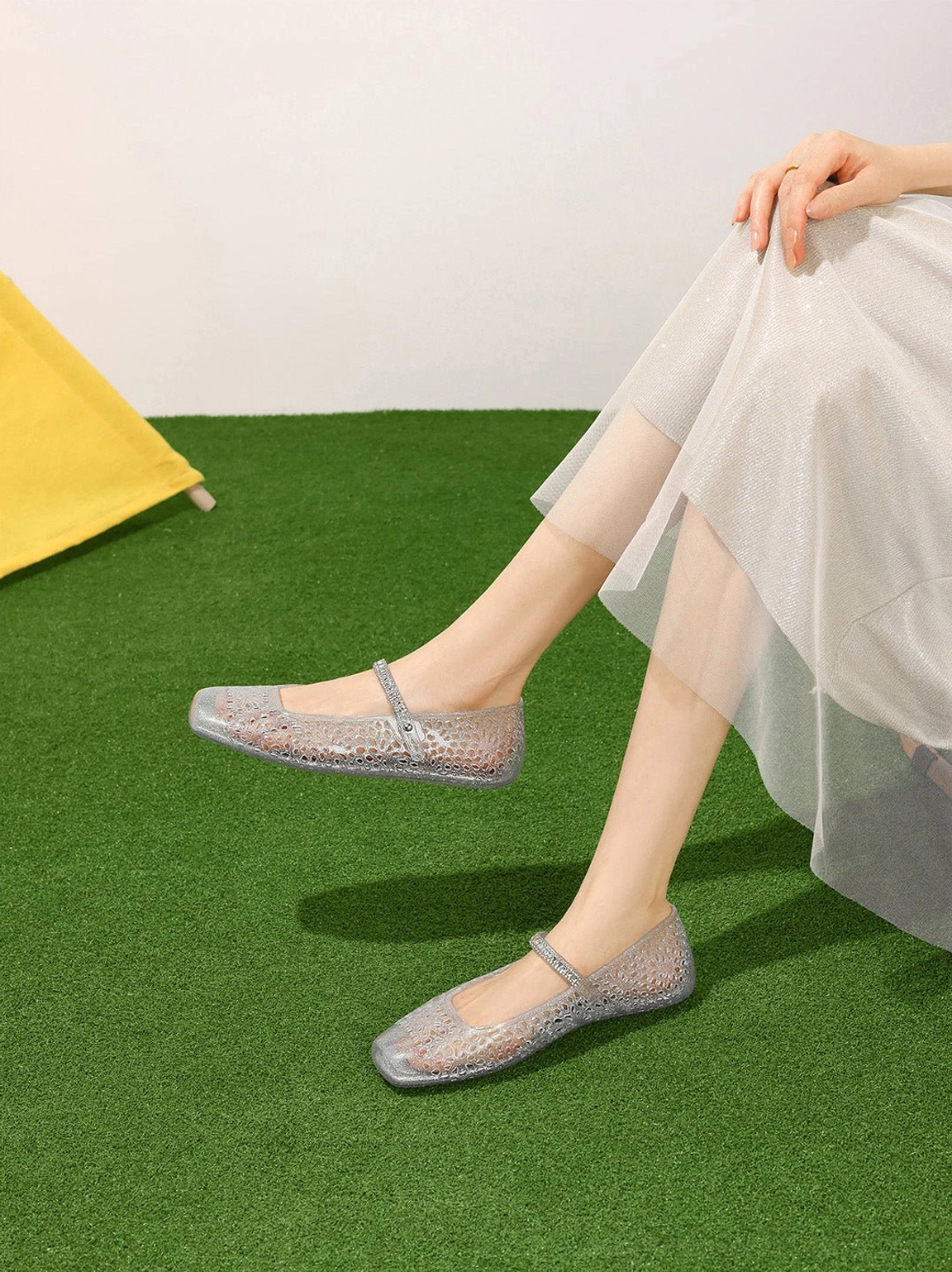Silver crystal glitter Mary Jane ballet flats with flexible flat sole styled with flowing white skirt