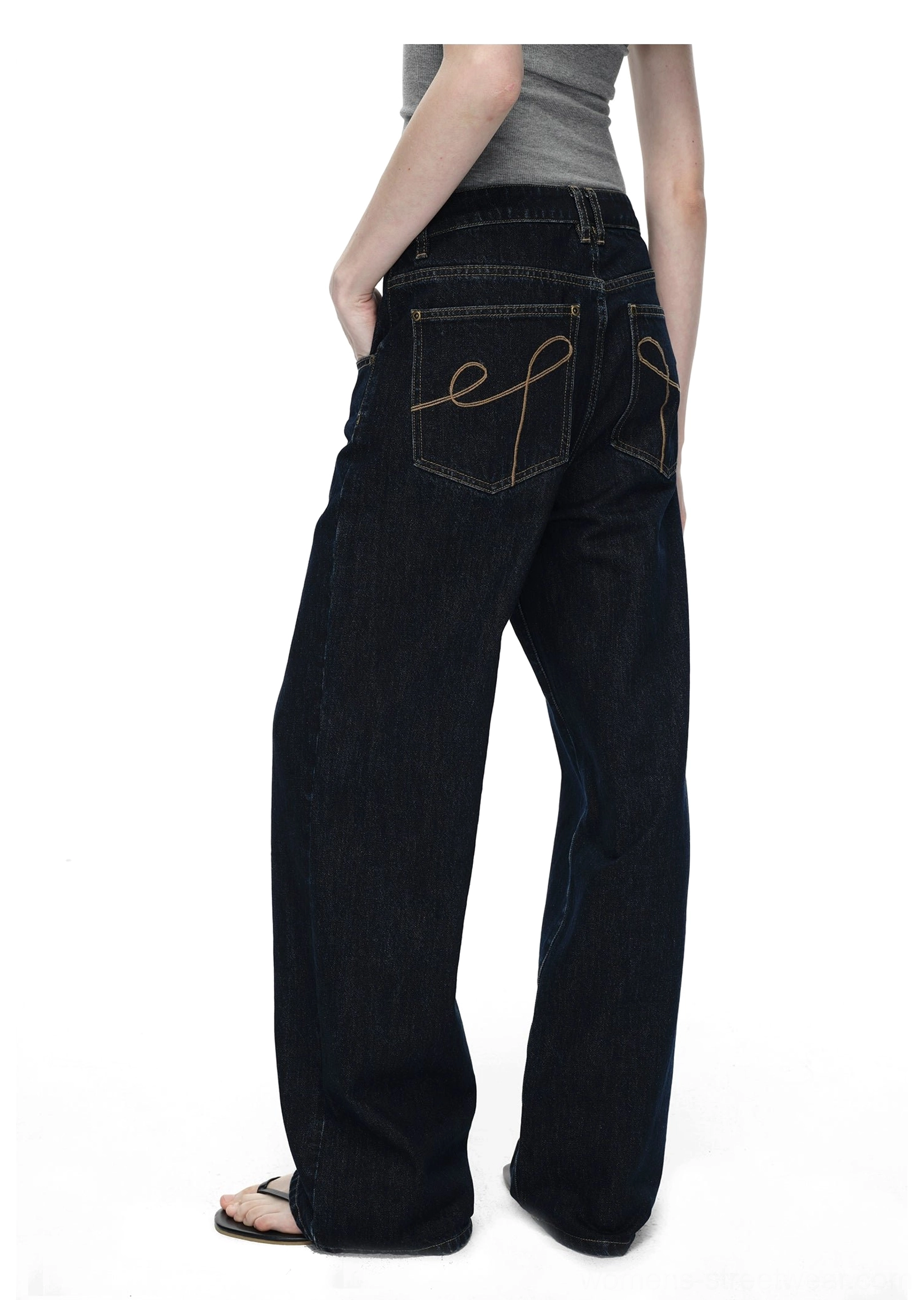 Dark blue cotton raw denim jeans offering a high-waisted silhouette and comfortable everyday wide-leg fit