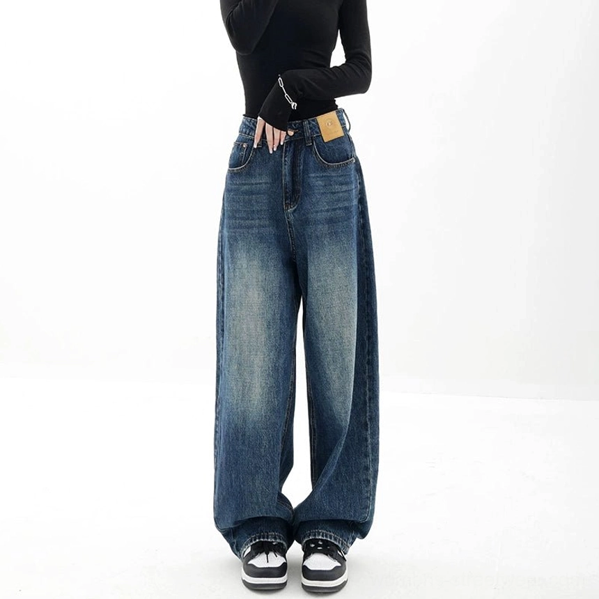Dark blue high-waisted wide-leg denim jeans with a relaxed full-length silhouette, classic five-pocket styling, and women's streetwear versatility