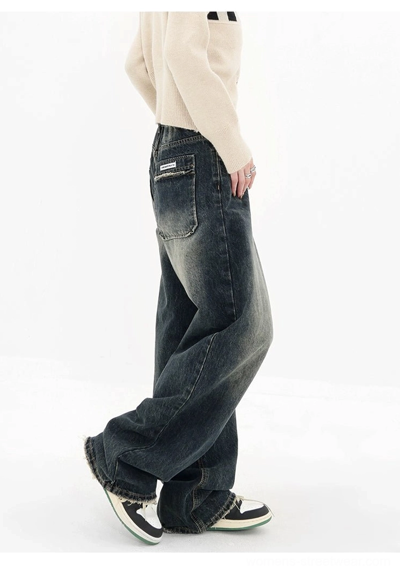 Dark blue high-waisted wide-leg jeans back pocket detail with relaxed vintage streetwear denim silhouette