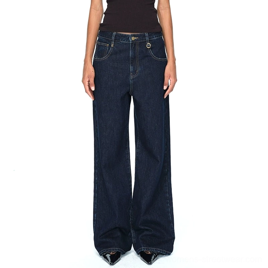 Dark blue raw denim wide-leg jeans in deep indigo with embroidered back pockets and relaxed high-waisted fit