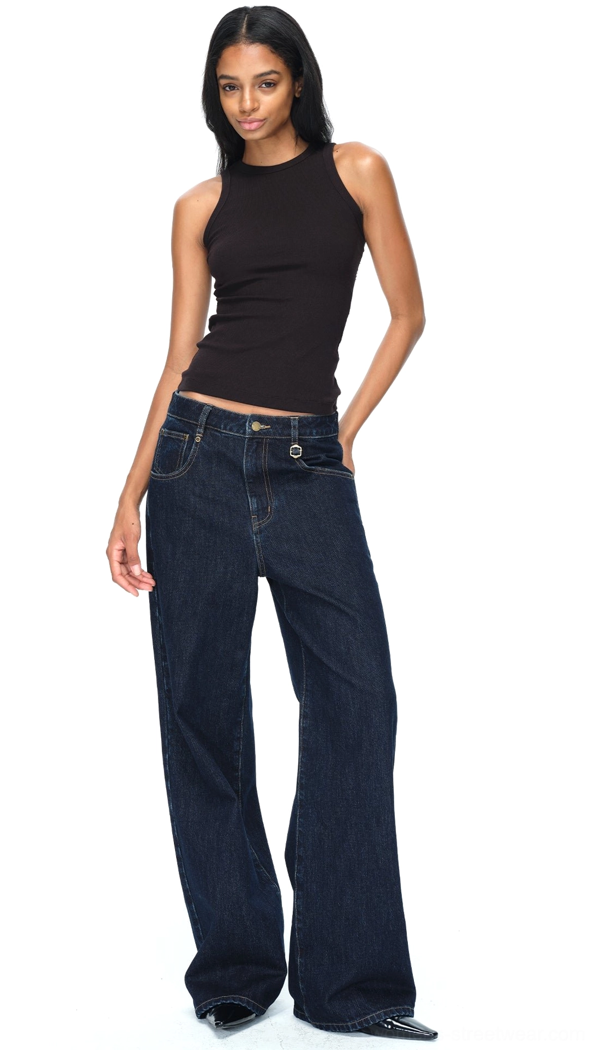Side three quarter view of dark blue raw denim wide-leg jeans showing the side seam, front pocket, and relaxed fit