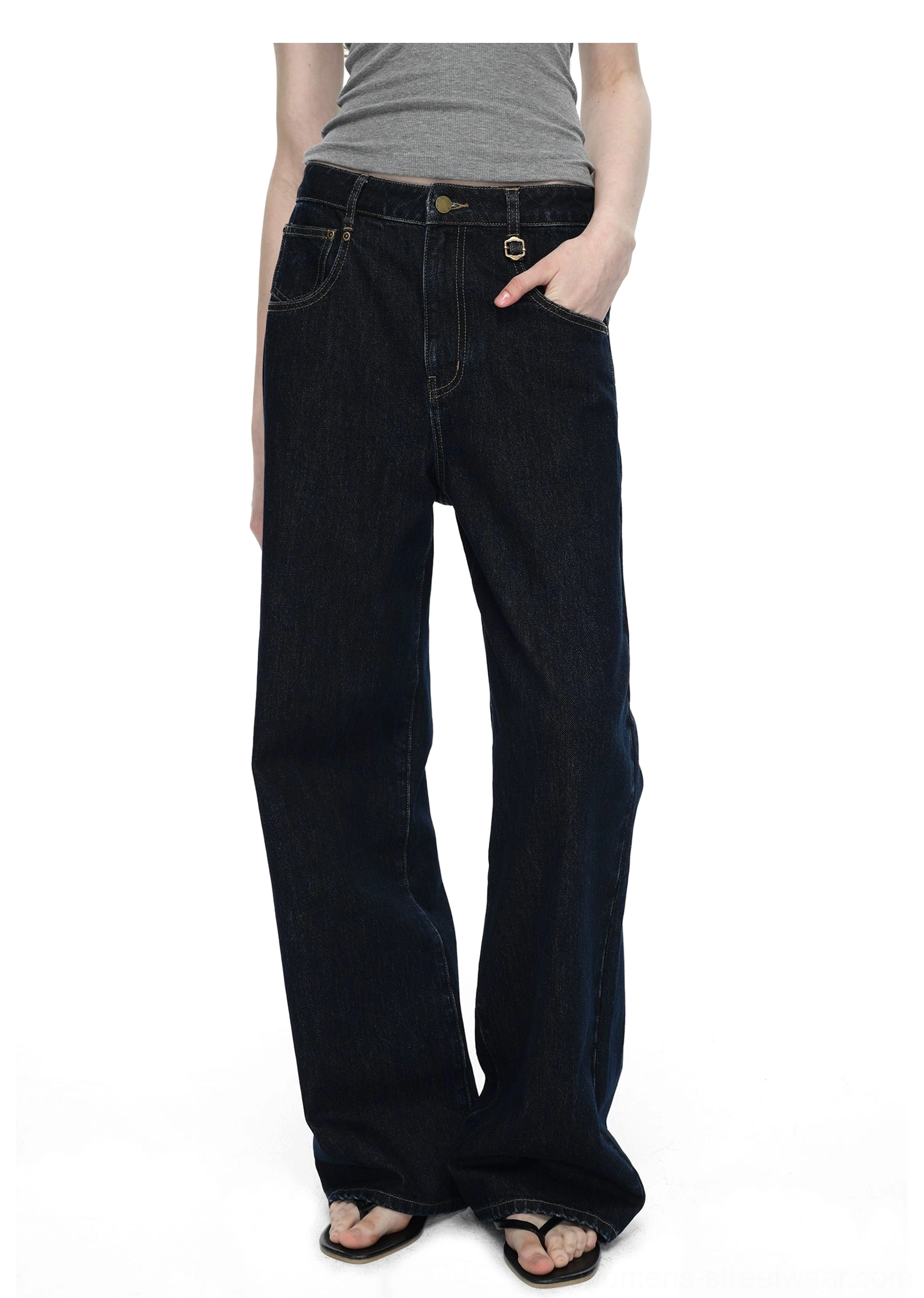 Unisex-inspired dark blue raw denim wide-leg jeans with clean lines and contemporary urban fashion appeal