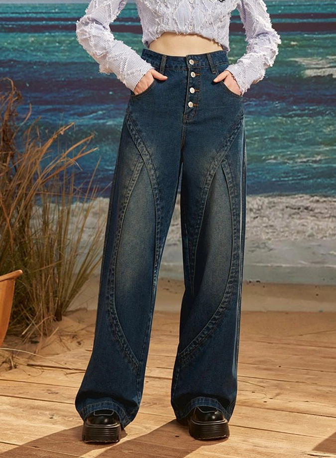 Women's dark blue retro wide leg jeans with exposed four-button fly, high rise waist and curved seam panel details