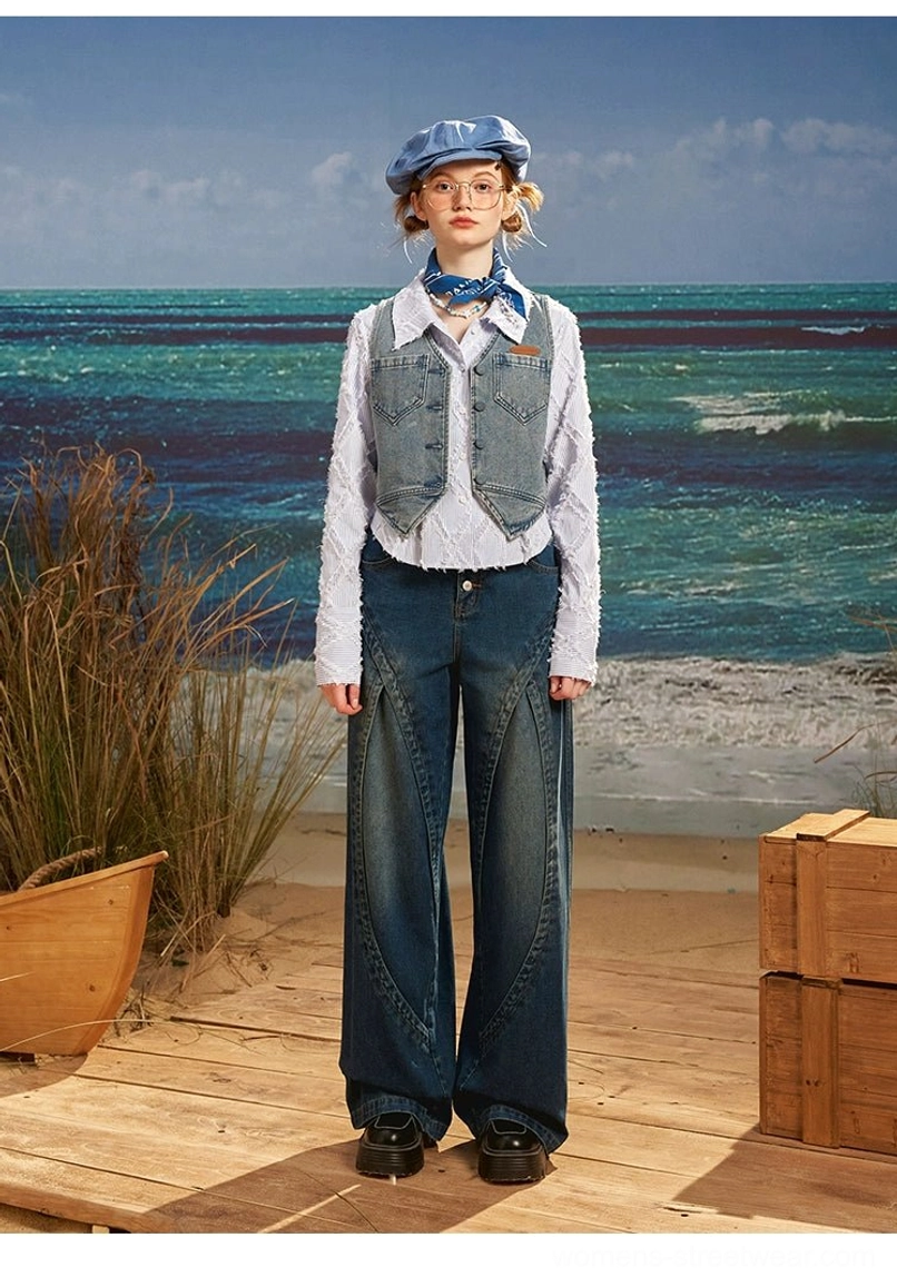 Full front view of dark blue vintage wash wide leg jeans with high waist, relaxed fit and curved tailored leg seam details