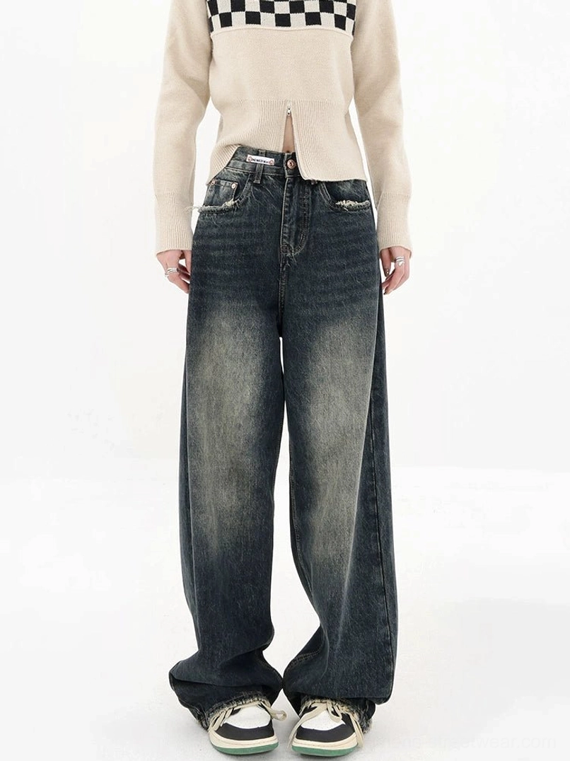 Dark blue wide-leg denim jeans full front view with high waist relaxed legs and frayed raw hem detail