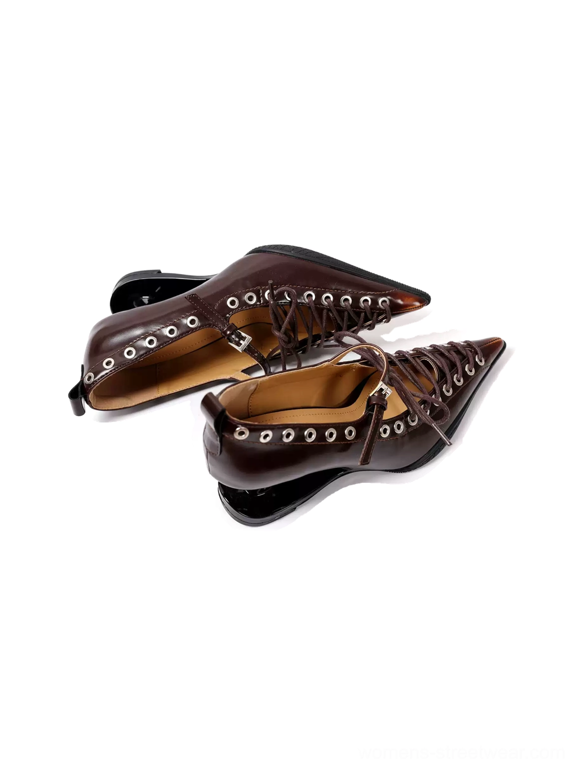 Pair of dark brown corset-lace pointed pumps with glossy finish, metal eyelets, and low curved sculpted heels on a white background