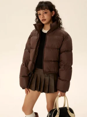 Dark brown cropped puffer jacket three-quarter view with relaxed quilted silhouette for Korean streetwear styling