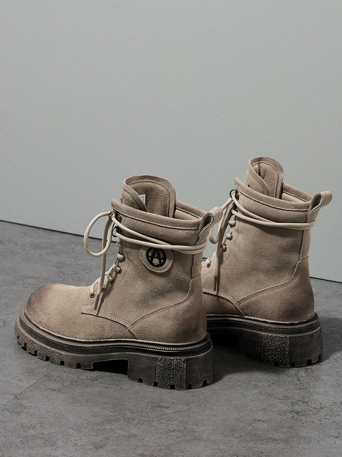 Dark brown distressed platform combat boots worn with streetwear outfit showing styling versatility Y2K aesthetic presentation