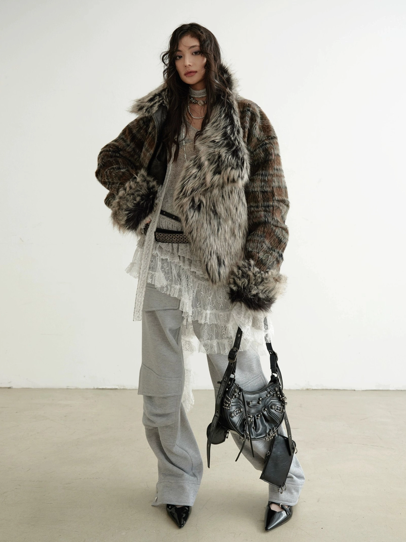 Dark brown faux fur trim cropped jacket for women styled as a statement winter streetwear outerwear look