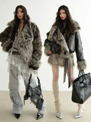 Two women wearing dark brown faux fur trim cropped jackets in relaxed winter streetwear outfits with layered tops and loose trousers