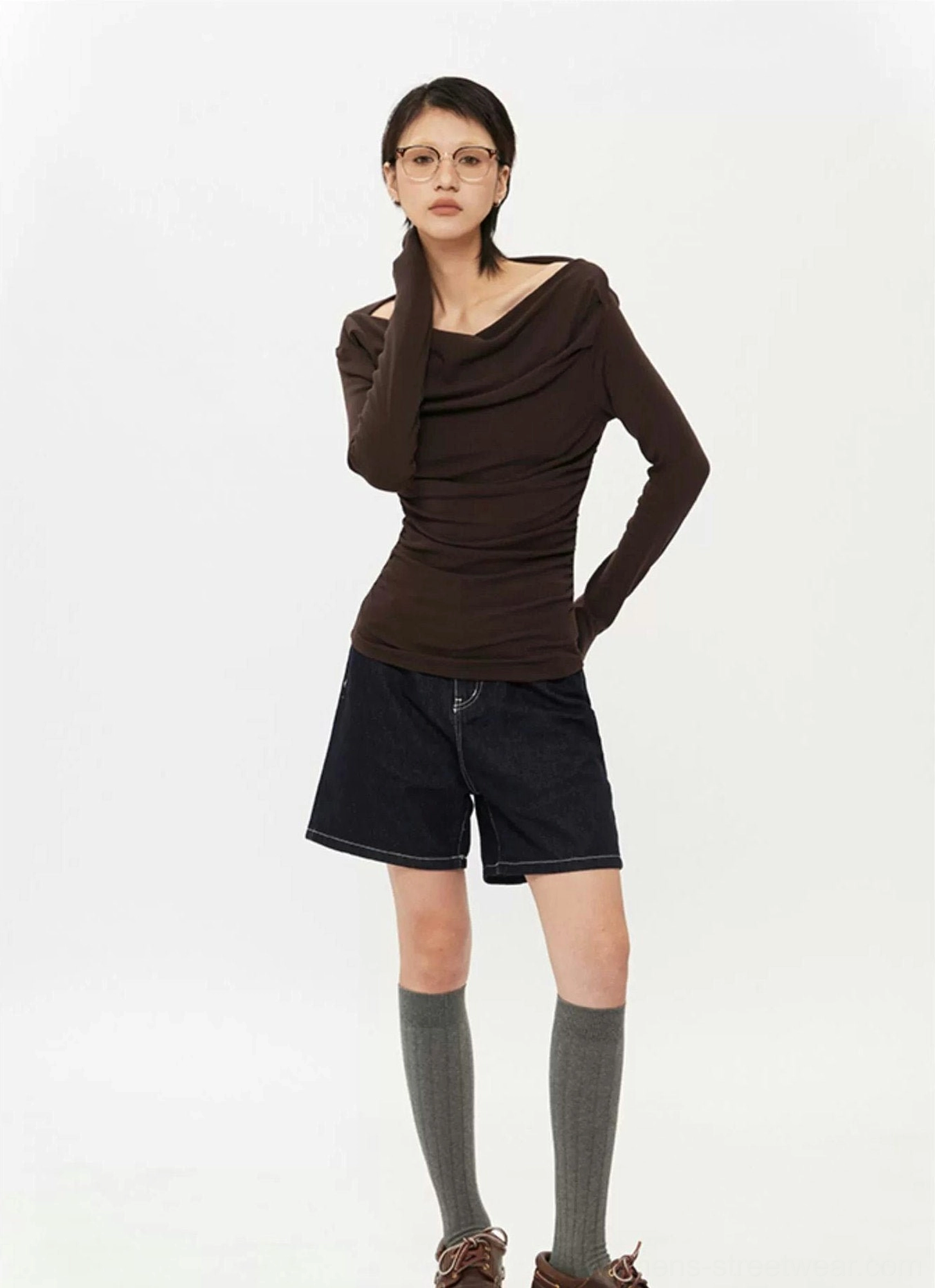 Three-quarter streetwear outfit view featuring a dark brown fitted off-shoulder ruched top with draped neckline