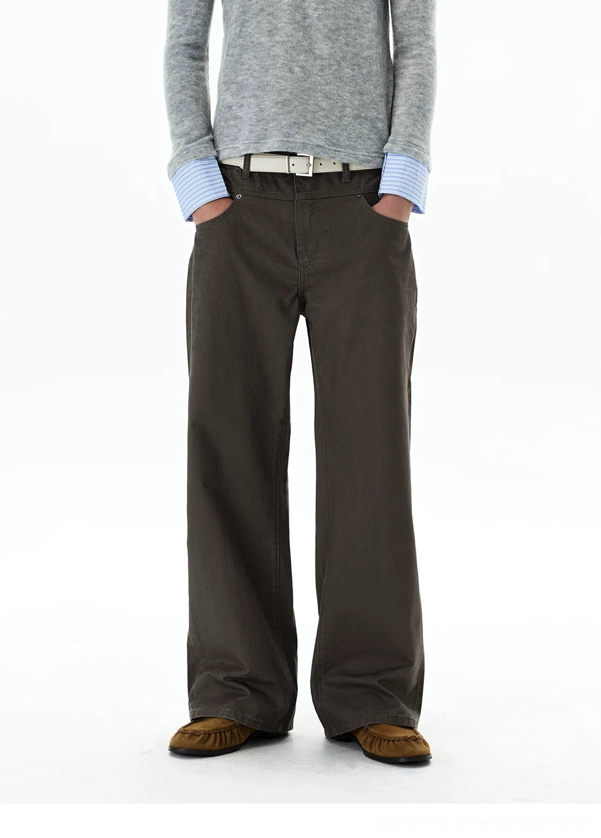 Close front view of dark brown high-waisted wide-leg chino pants with belt loops, cotton drape, and hands in pockets
