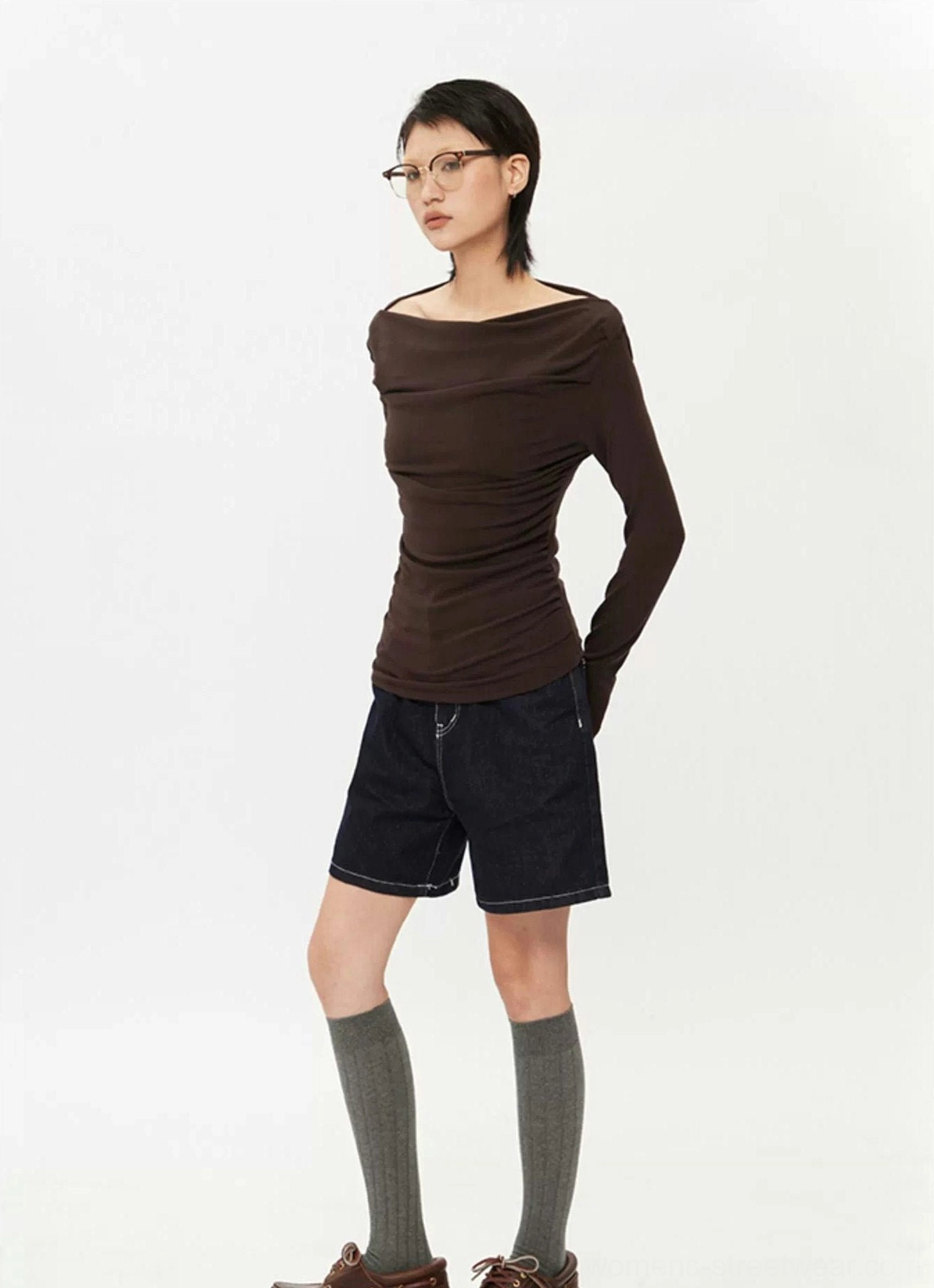 Full-body side view of dark brown Korean streetwear off-shoulder ruched top with slim fit and long sleeves