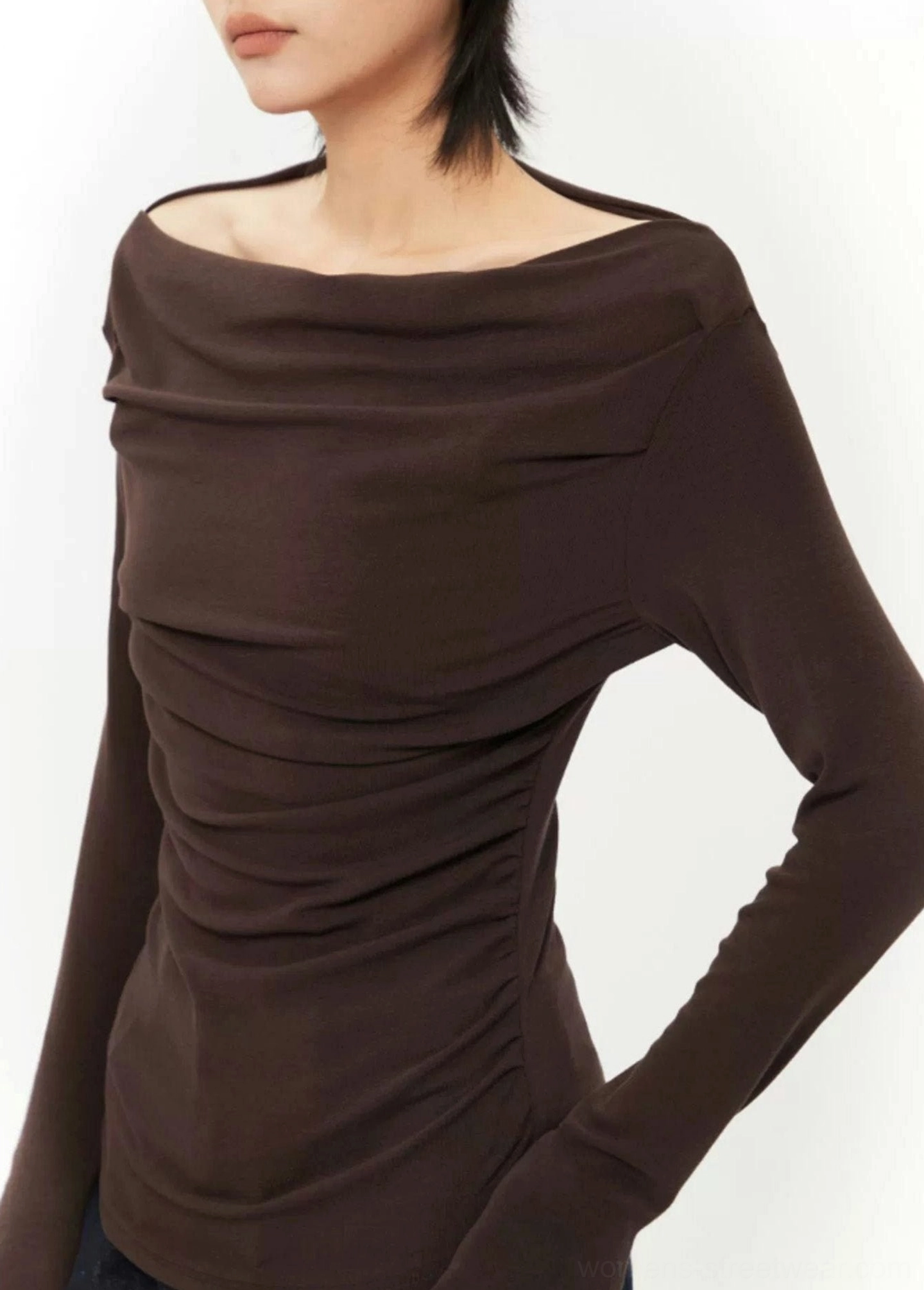 Dark brown ruched long-sleeve off-shoulder top close-up highlighting the fitted silhouette and textured knit-style fabric