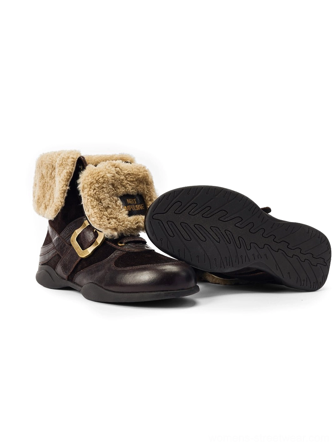 Side profile of dark brown shearling-cuff leather ankle boot displaying the rubber outsole tread