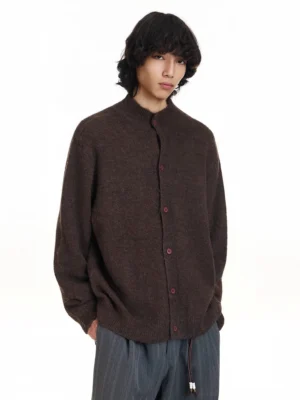 Dark brown stand collar knit cardigan with fuzzy textured fabric, red buttons, oversized streetwear fit, and wide-leg striped trousers