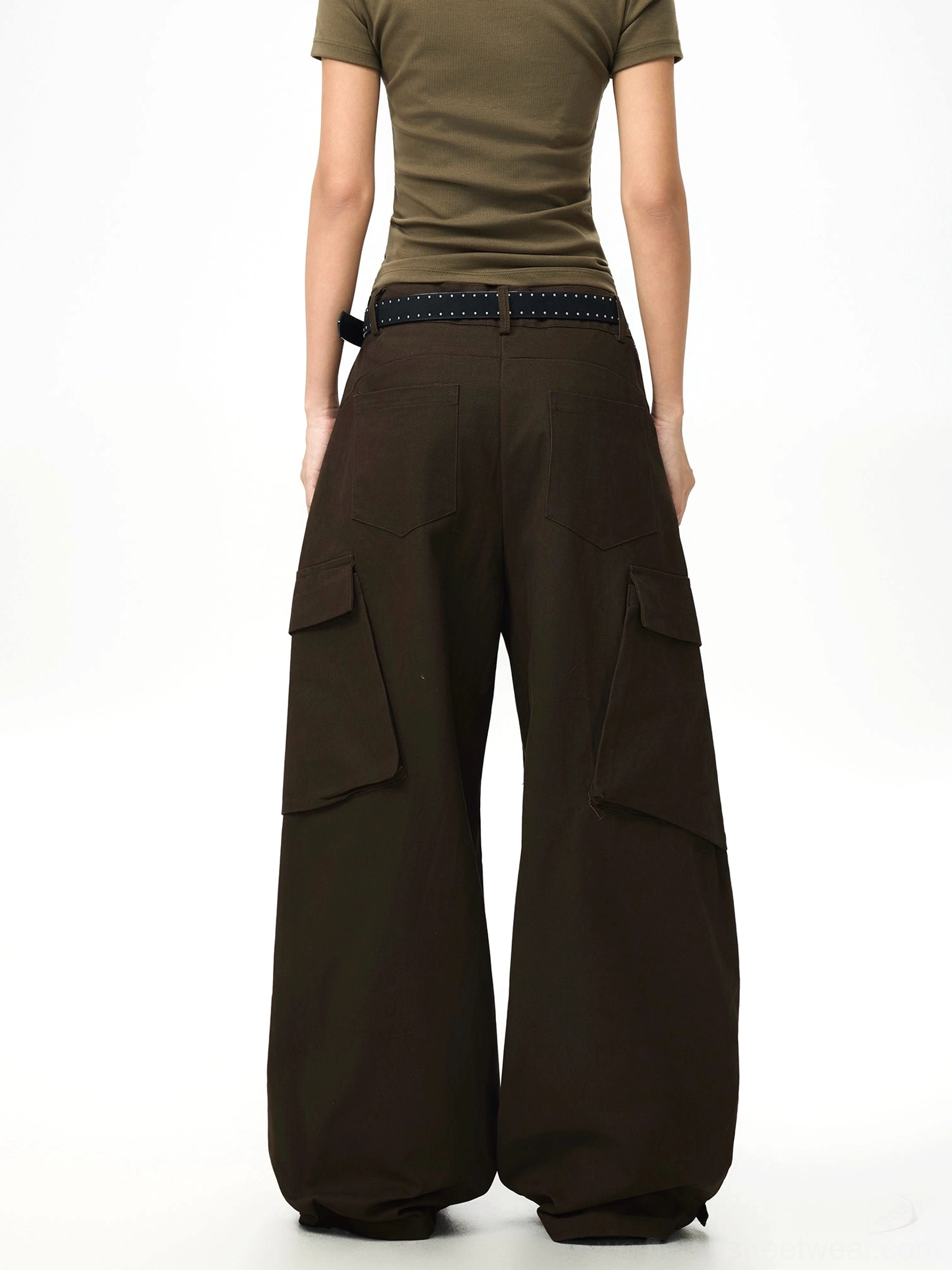 Side back view of dark brown wide-leg cargo pants with rear belt loops tailored side pockets and loose relaxed fit