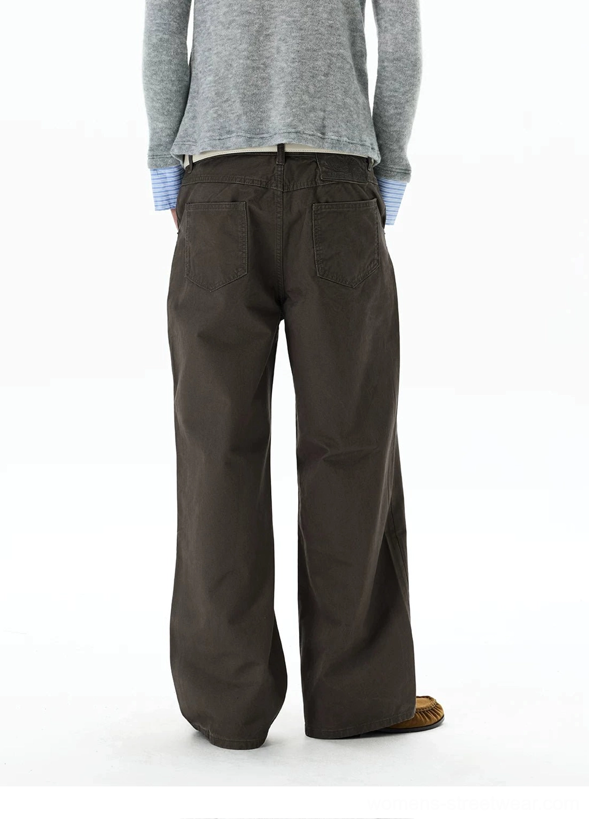 Back view of dark brown wide-leg chino streetwear pants with dual rear patch pockets and relaxed cotton silhouette