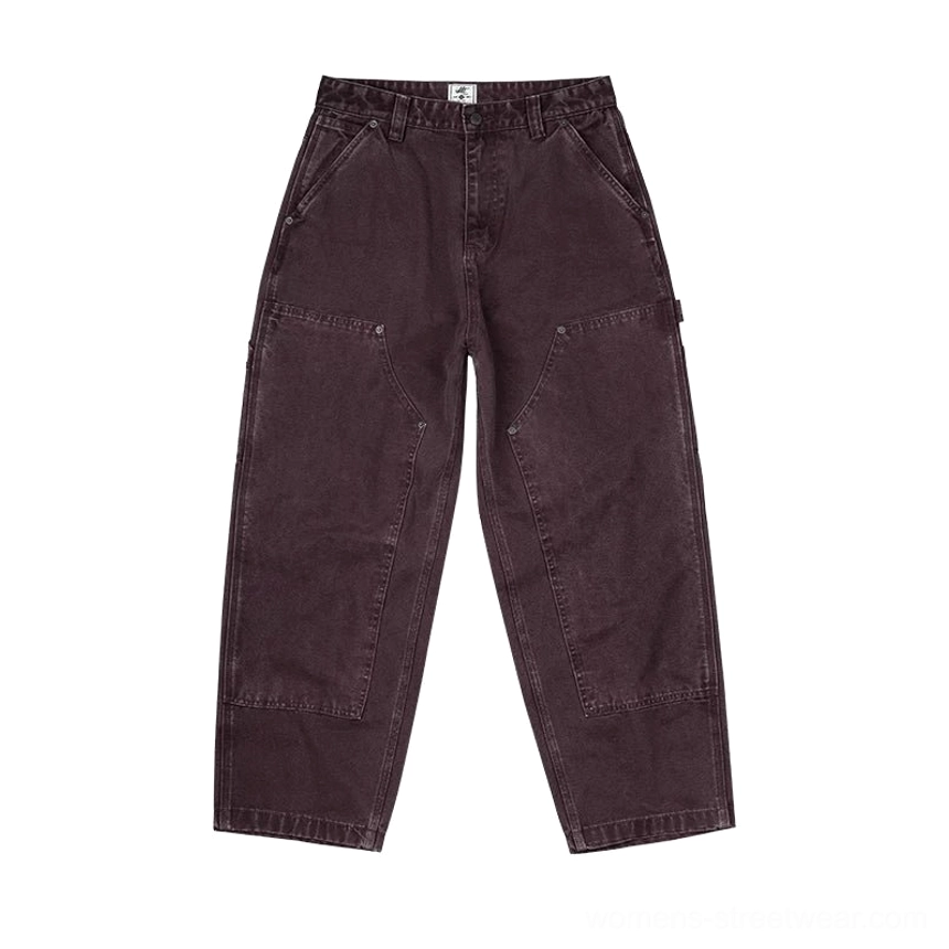Dark brown women's carpenter denim pants front view with relaxed workwear fit and reinforced knee panels