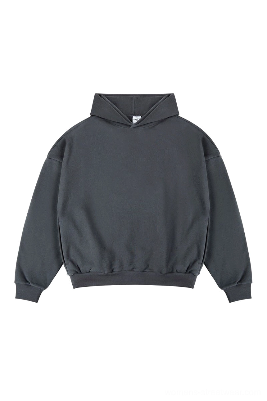 Dark charcoal gray oversized hoodie with dropped shoulder sleeves ribbed waistband and relaxed Korean streetwear fit