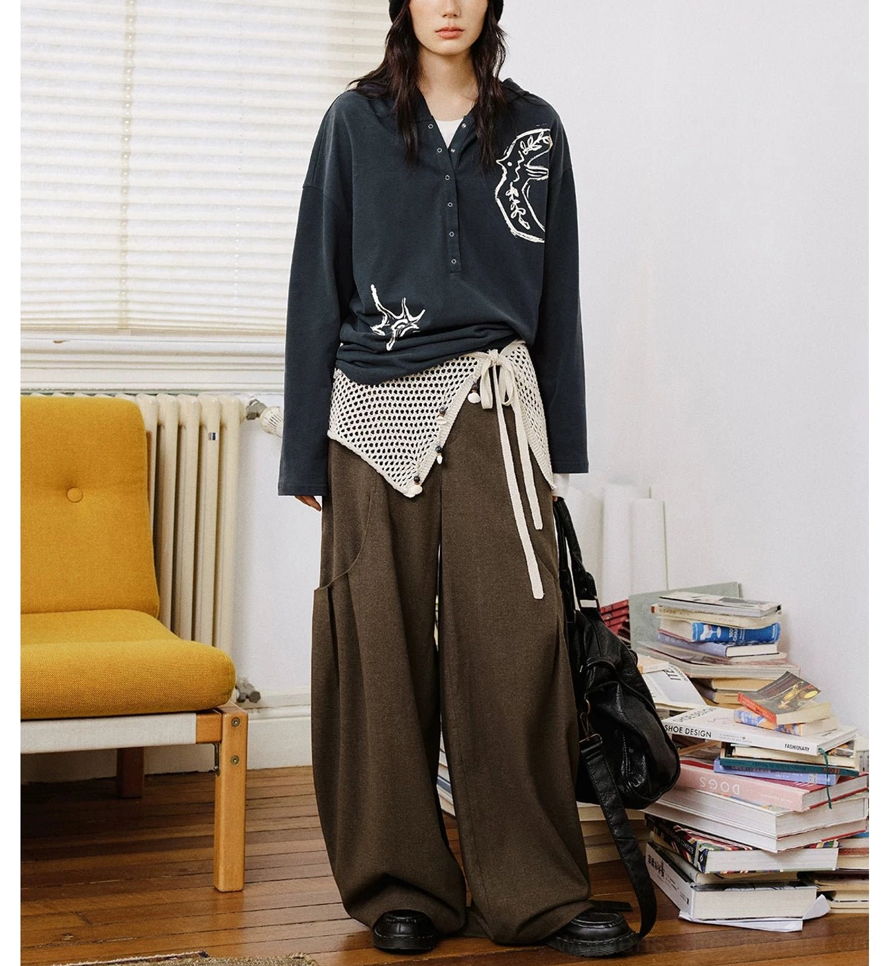 Dark charcoal oversized graphic embroidered Henley polo shirt with relaxed Korean streetwear styling and wide-leg pants