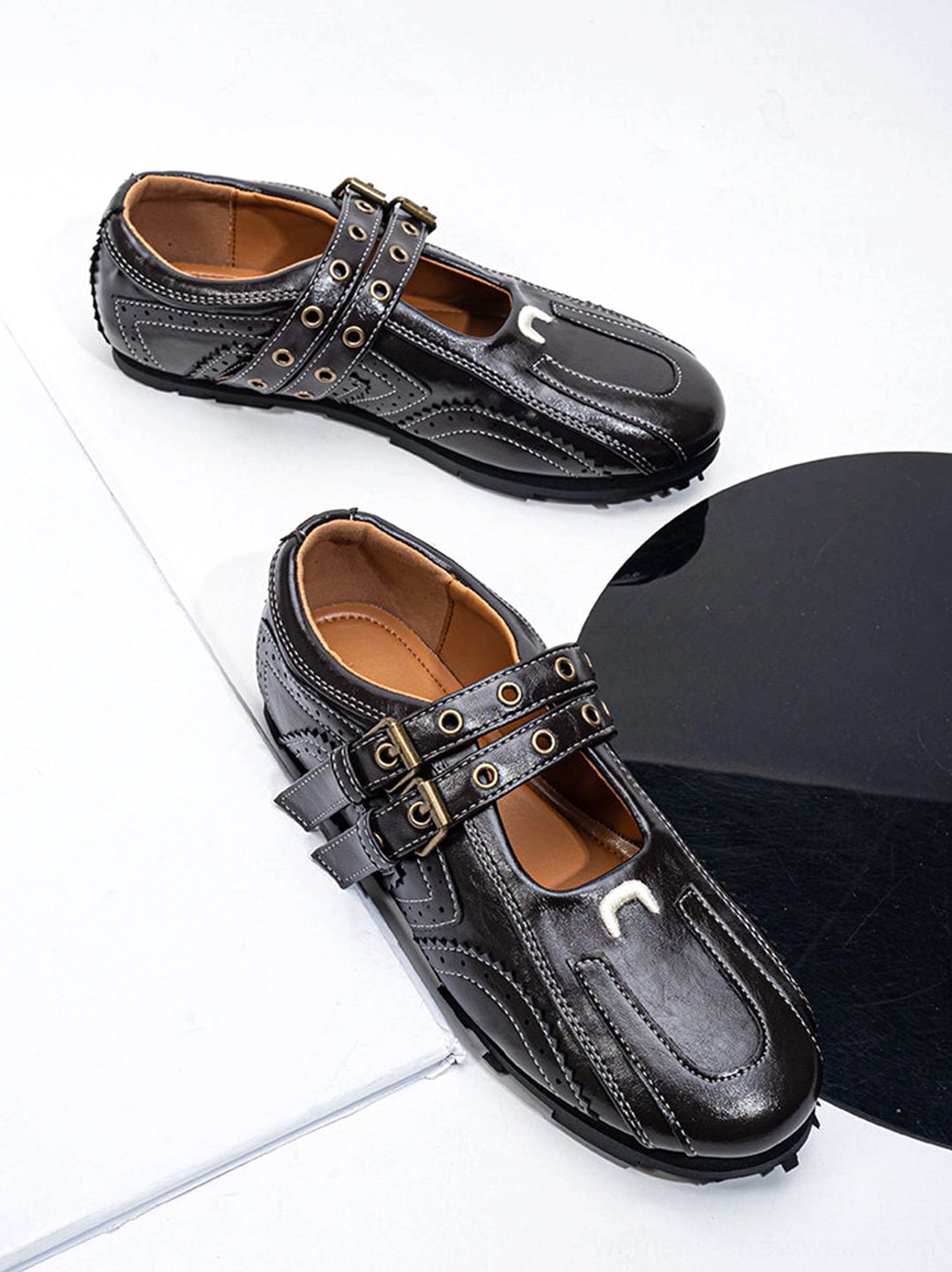 Dark coffee streetwear flats featuring a glossy finish square toe and double metal buckles