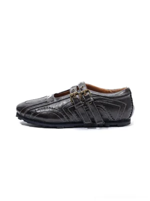Dark coffee studded double-buckle square-toe flat shoe shown in a left side product view with glossy finish and brogue-style stitching