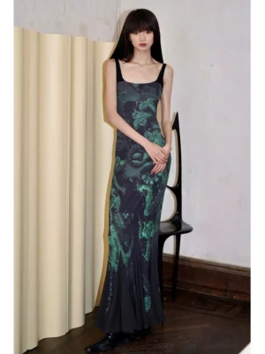 Dark green and black floral bodycon fishtail maxi dress shown in a full front view with slim square straps and floor-length mermaid silhouette