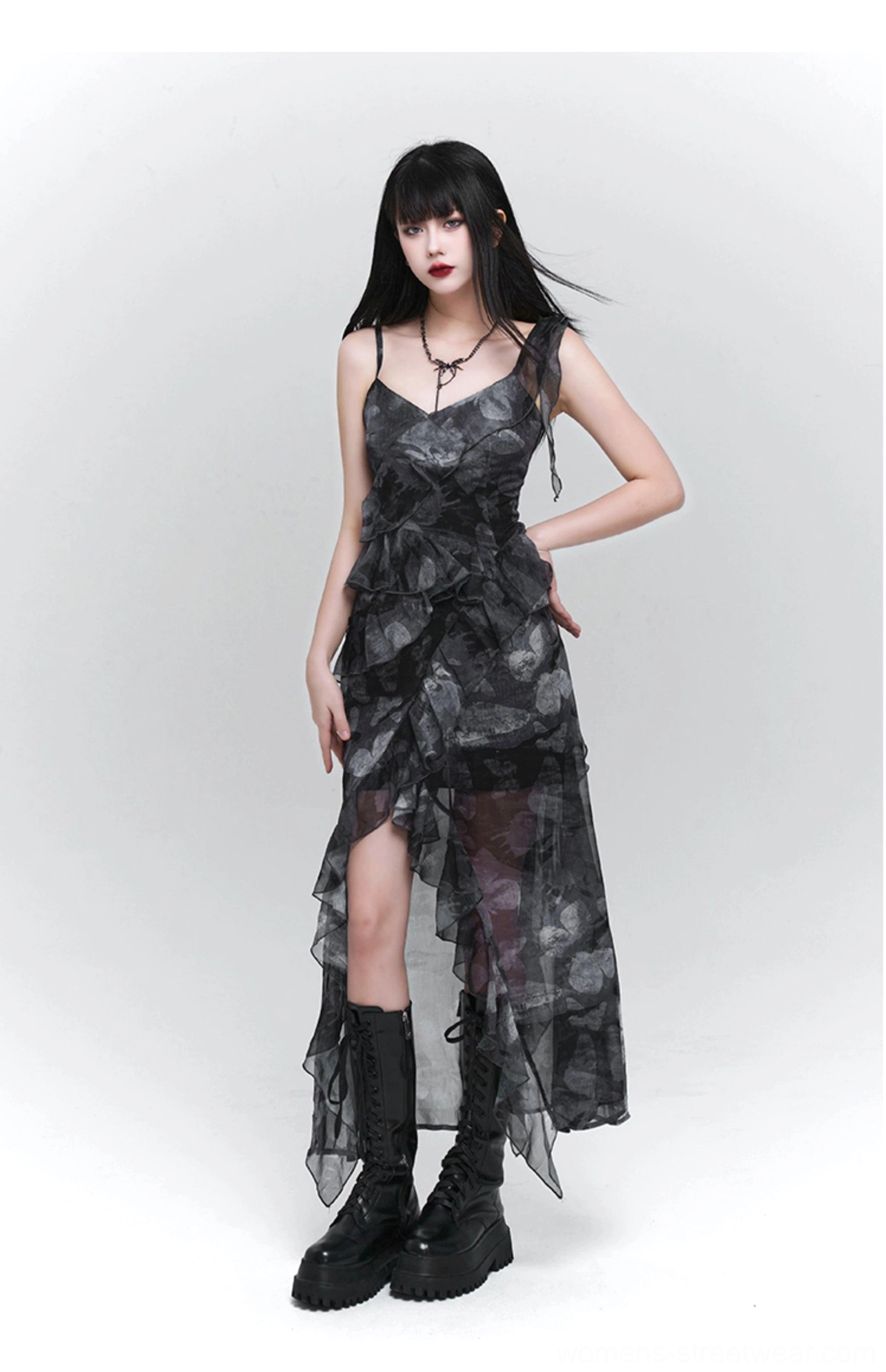 Front view of a dark floral maxi slip dress with V-neck spaghetti straps, layered front ruffles, uneven hem, and alternative goth styling