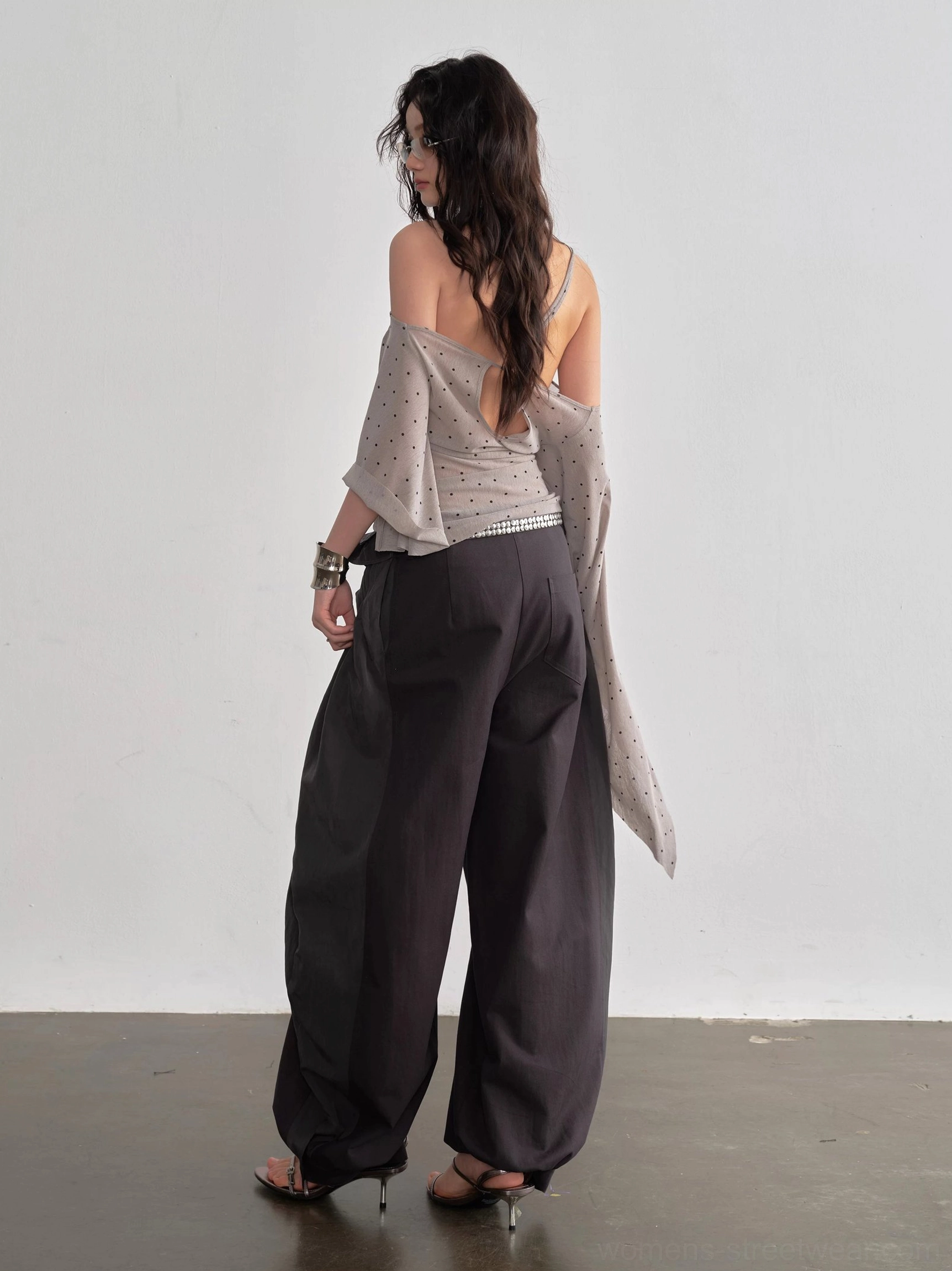 Dark gray high waist balloon streetwear pants back view showing relaxed wide leg drape and tie waist