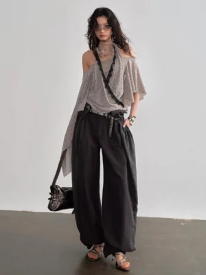 Dark gray balloon tie waist streetwear pants front view styled with off shoulder top and strappy heels