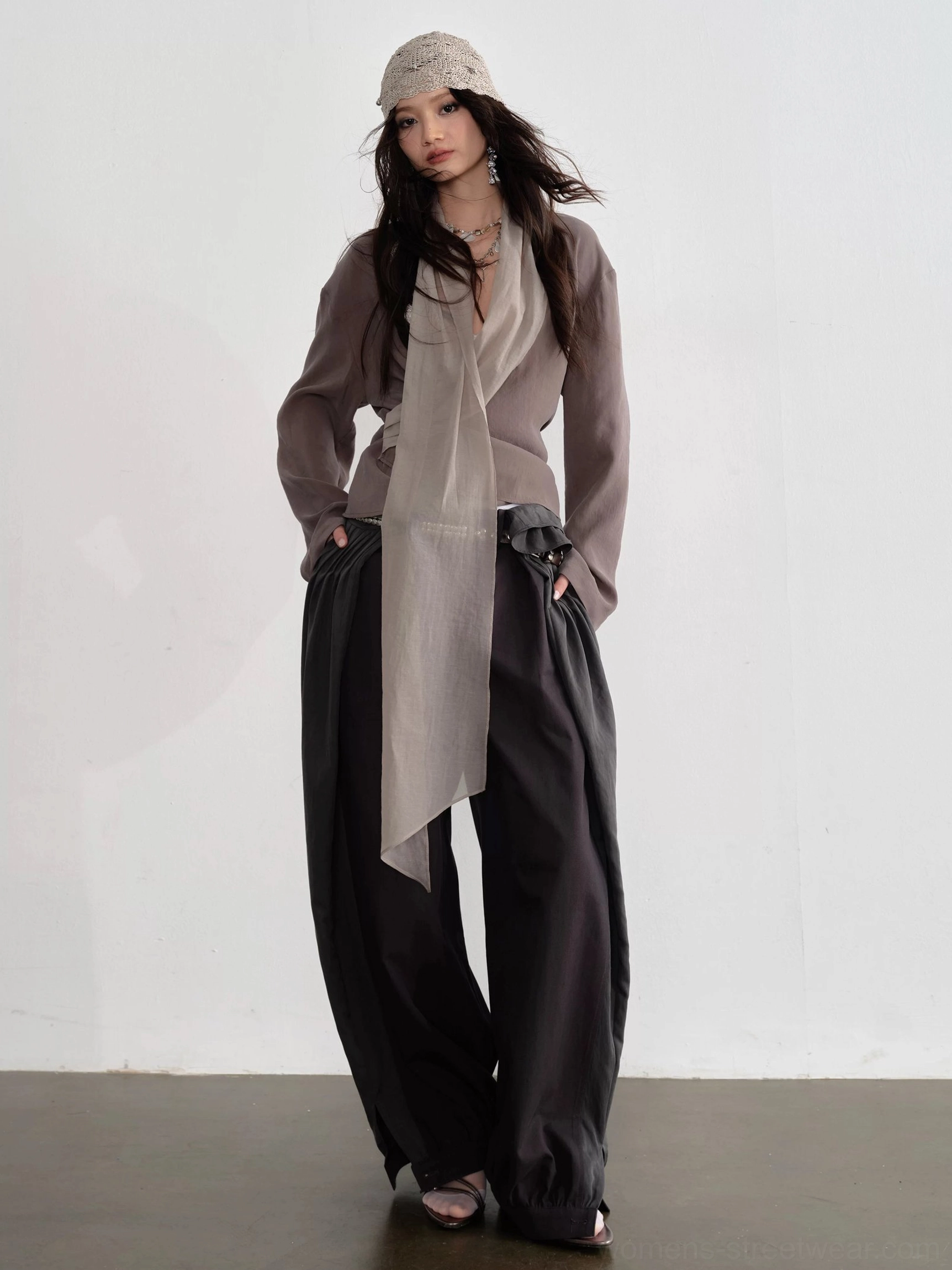 Dark gray balloon tie waist pants with draped scarf and fitted top in minimalist Korean streetwear styling