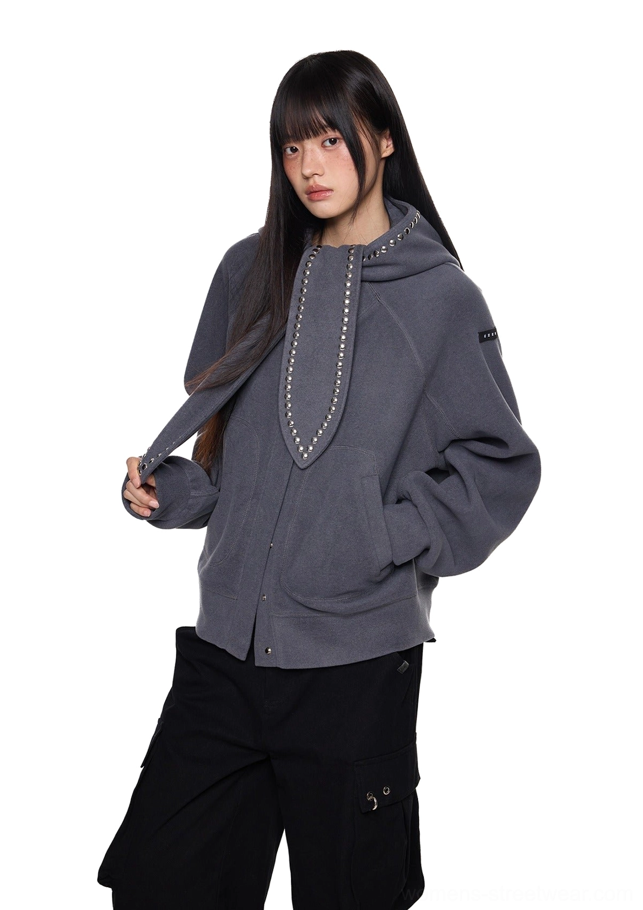 Dark gray oversized bunny ear hoodie styled with black wide-leg pants and a silver rivet trimmed hood in Acubi fashion