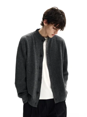 Dark gray button front stand collar knit cardigan with dropped shoulders side three quarter studio view