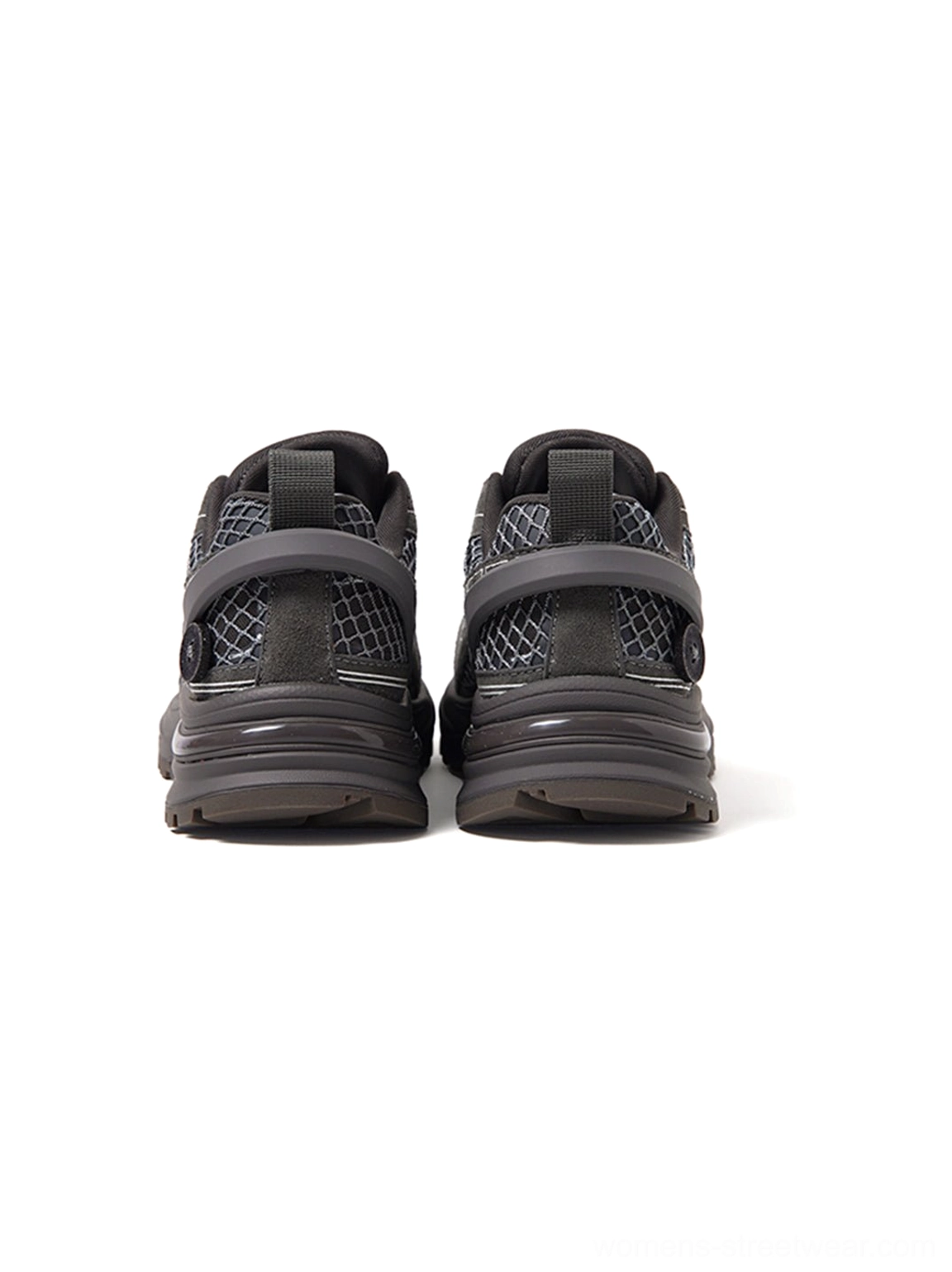 Rear view of dark gray chunky runner sneakers showing heel pull tabs structured heel panels and rubber outsole