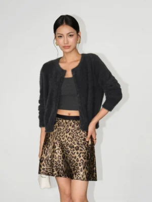 Dark gray fuzzy cropped cardigan with crew neckline styled with a gray crop top and leopard mini skirt for an edgy Seoul streetwear look