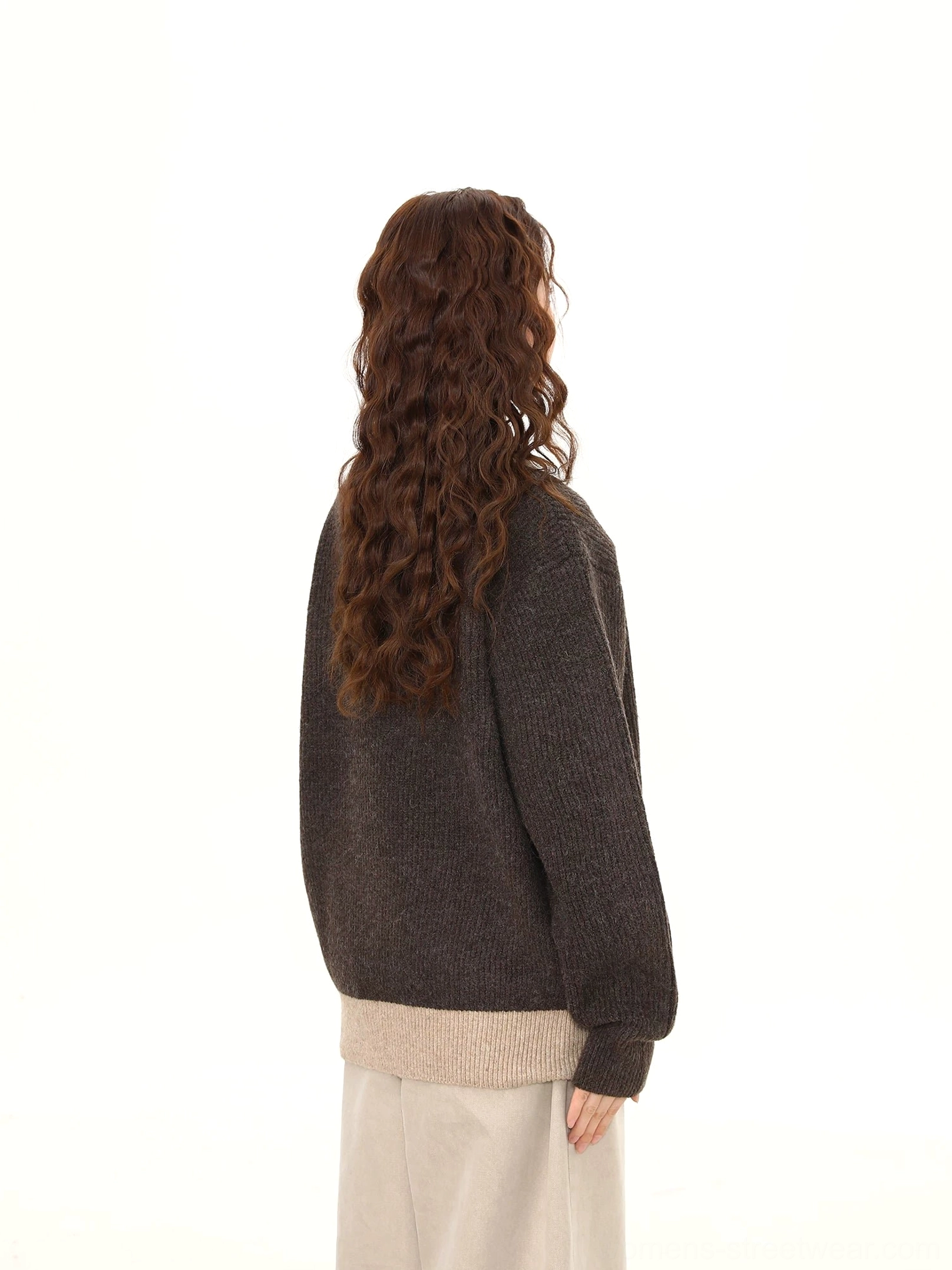 Back view of dark gray loose-fit layered polo collar knit sweater showing clean relaxed streetwear silhouette
