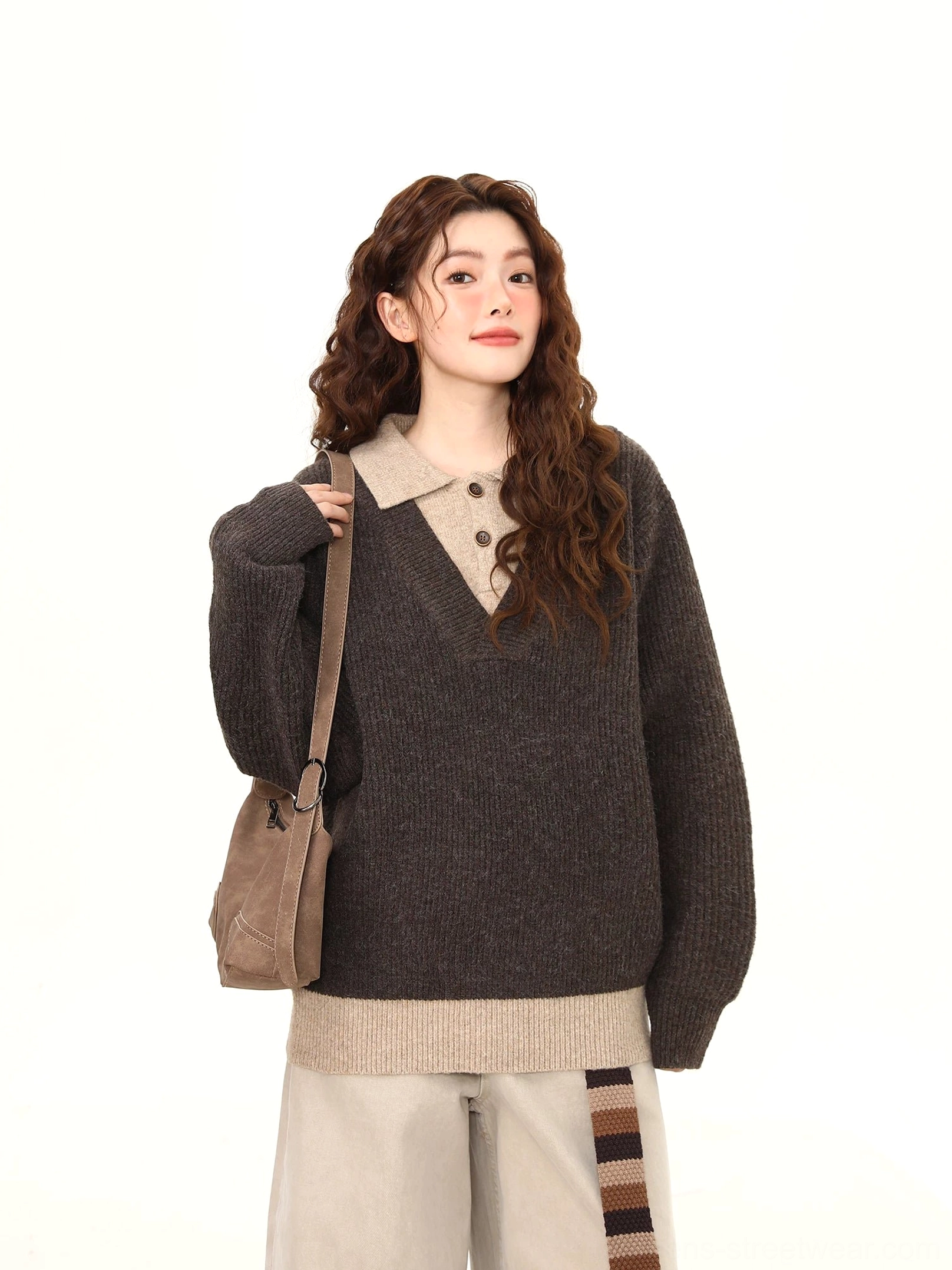 Front full-body view of relaxed dark gray layered polo collar knit sweater with ribbed contrast hem