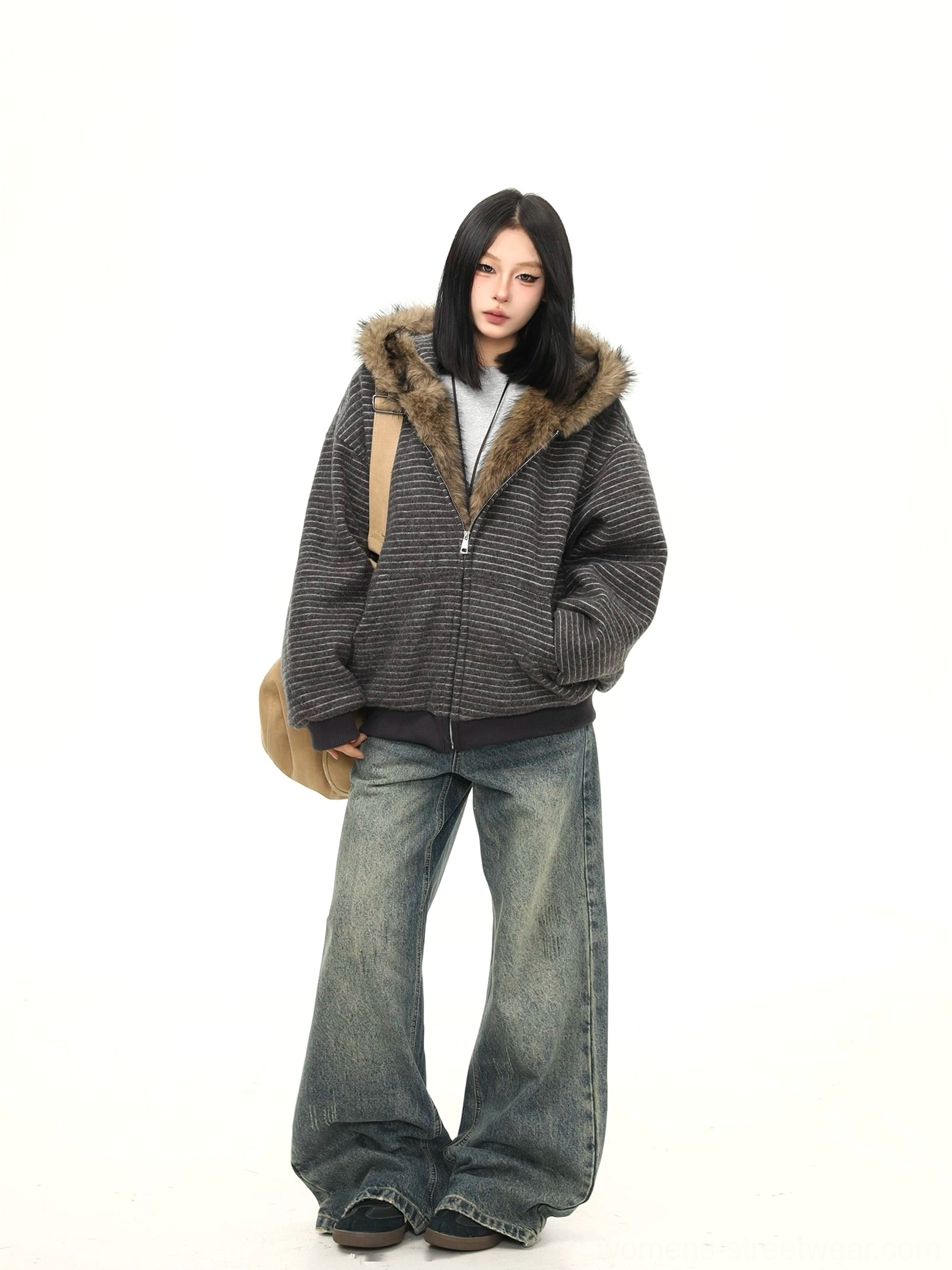 Dark gray oversized faux fur hooded jacket with horizontal stripes and dropped shoulders styled with vintage wide leg jeans