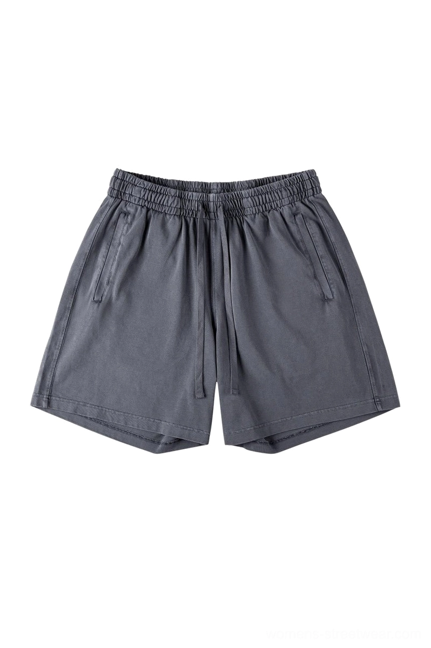 Dark gray washed cotton oversized casual shorts with elastic drawstring waist side pockets and relaxed streetwear silhouette