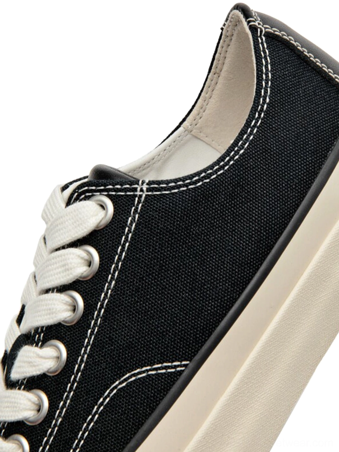 Dark green canvas platform sneaker low-top silhouette with cork midsole, minimalist streetwear design flat product display