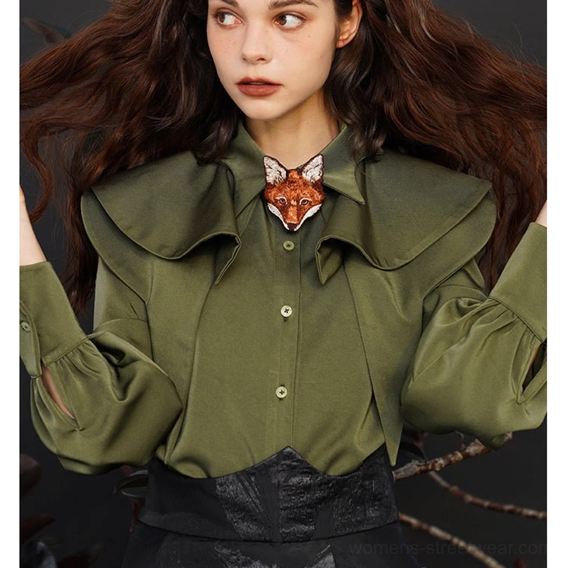 Side three quarter view of dark green fox charm blouse with botanical styling, layered collar, and lantern sleeves